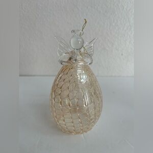BLOWN GLASS AND BELL SHAPED ANGEL ORNAMENT WITH PRAYING HANDS